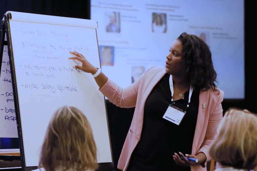 Customer Experience workshop session with presenter and attendees.