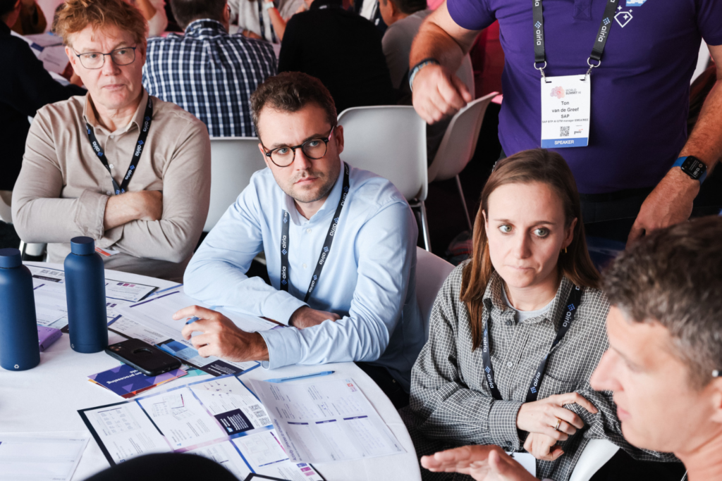 Delegates sharing ideas at the World AI Summit roundtable discussion.