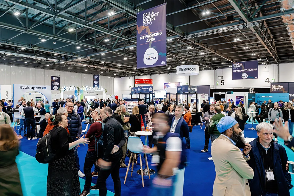 Attendees gathering and networking at the exhibition floor of the Contact Centre Expo