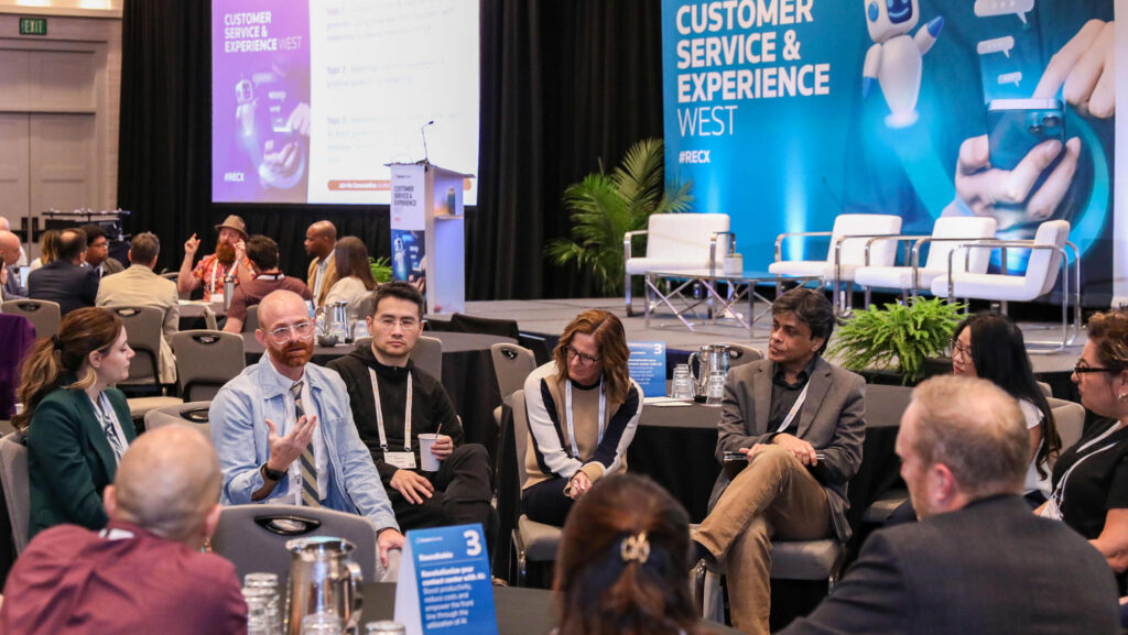 Attendees sharing insights at the Customer Service & Experience conference