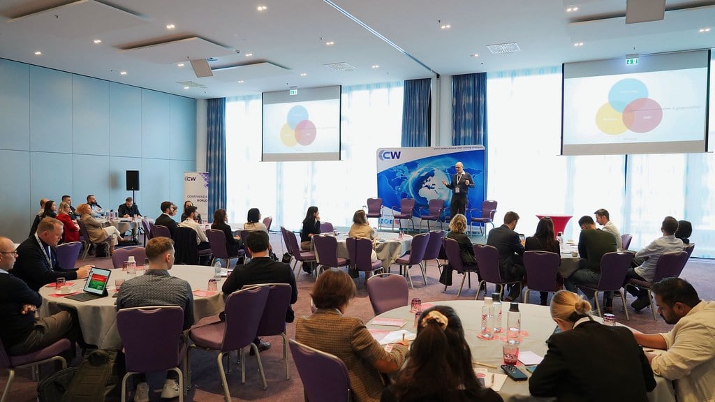 Conference attendees listening to a presentation at the Digital Transformation &amp; Customer Experience Summit.
